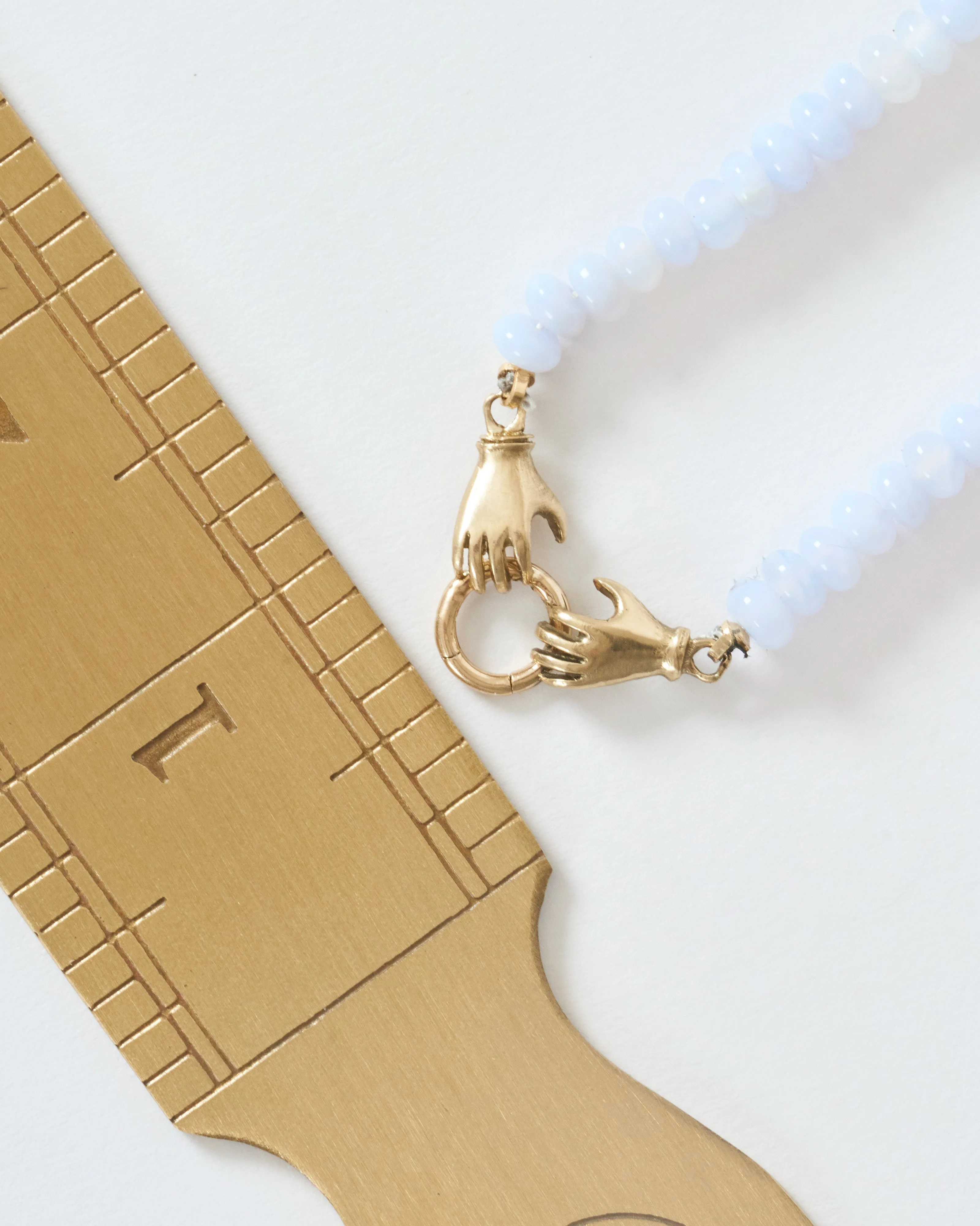 double hand charm holder necklace - gold/blue