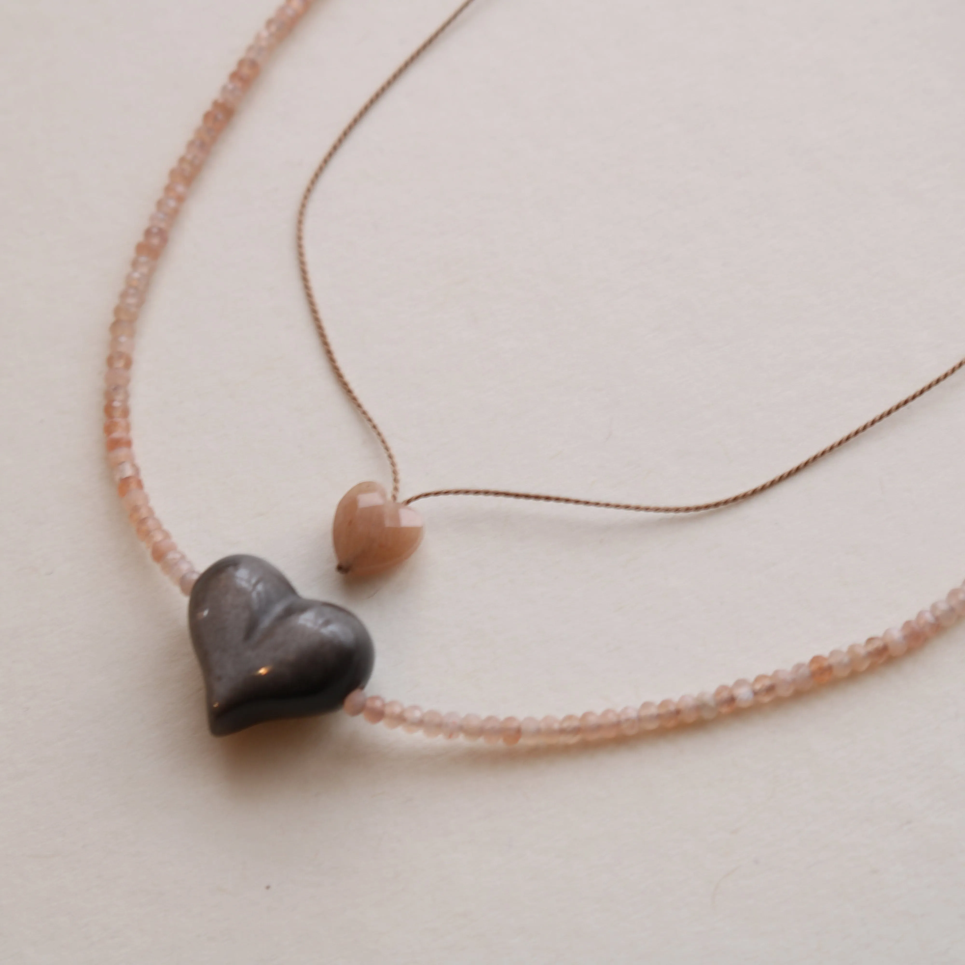 SILVER SHEEN OBSIDIAN HEART   PEACH MOONSTONE OM NECKLACE