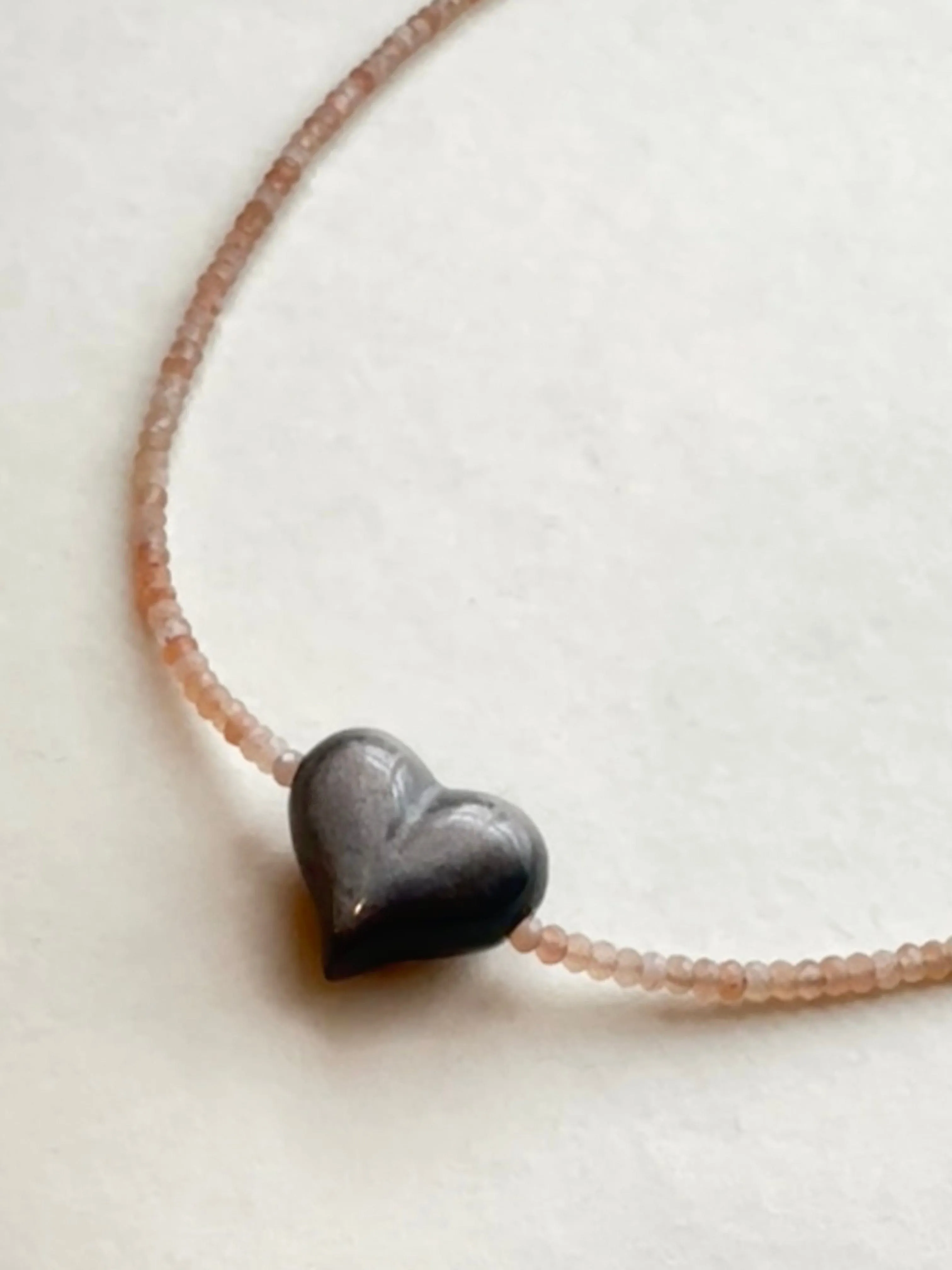 SILVER SHEEN OBSIDIAN HEART   PEACH MOONSTONE OM NECKLACE