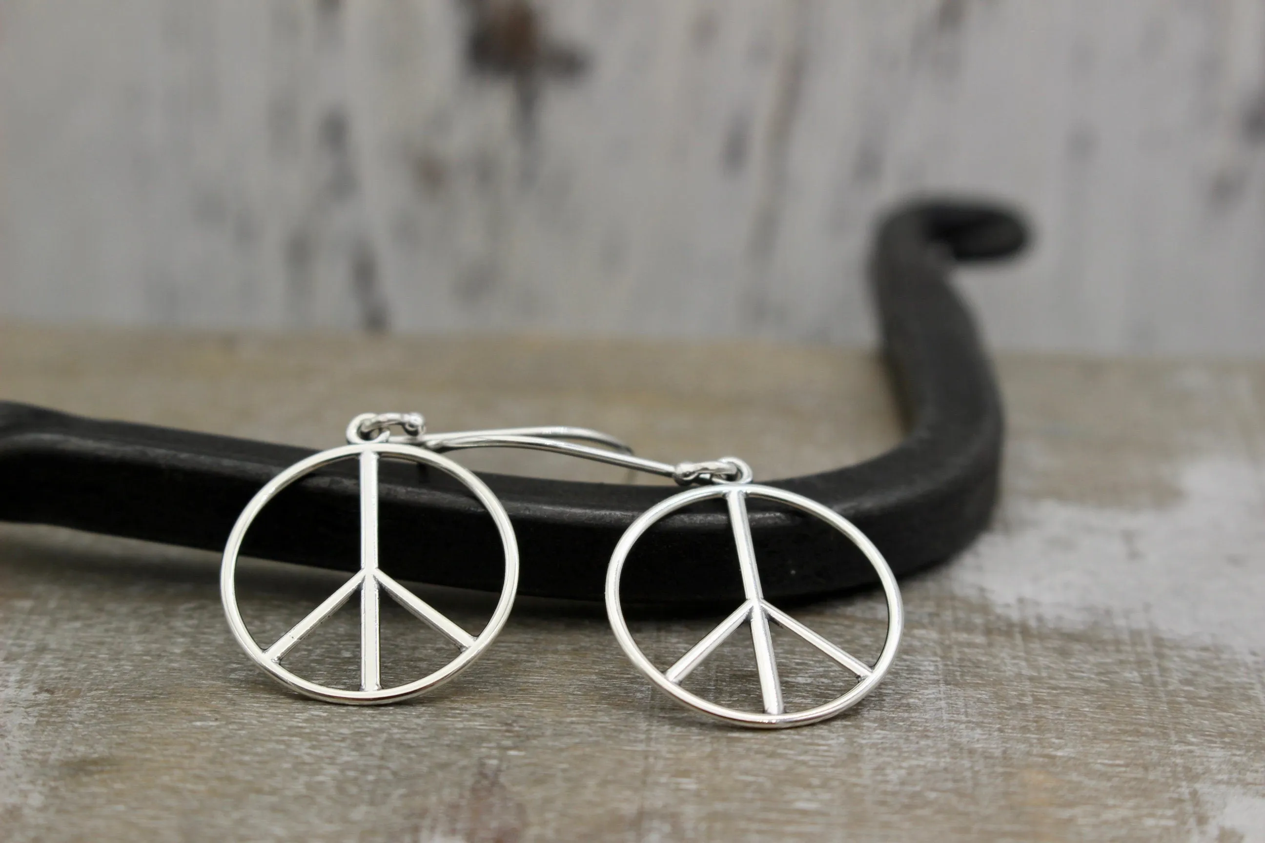 Sterling silver peace earrings