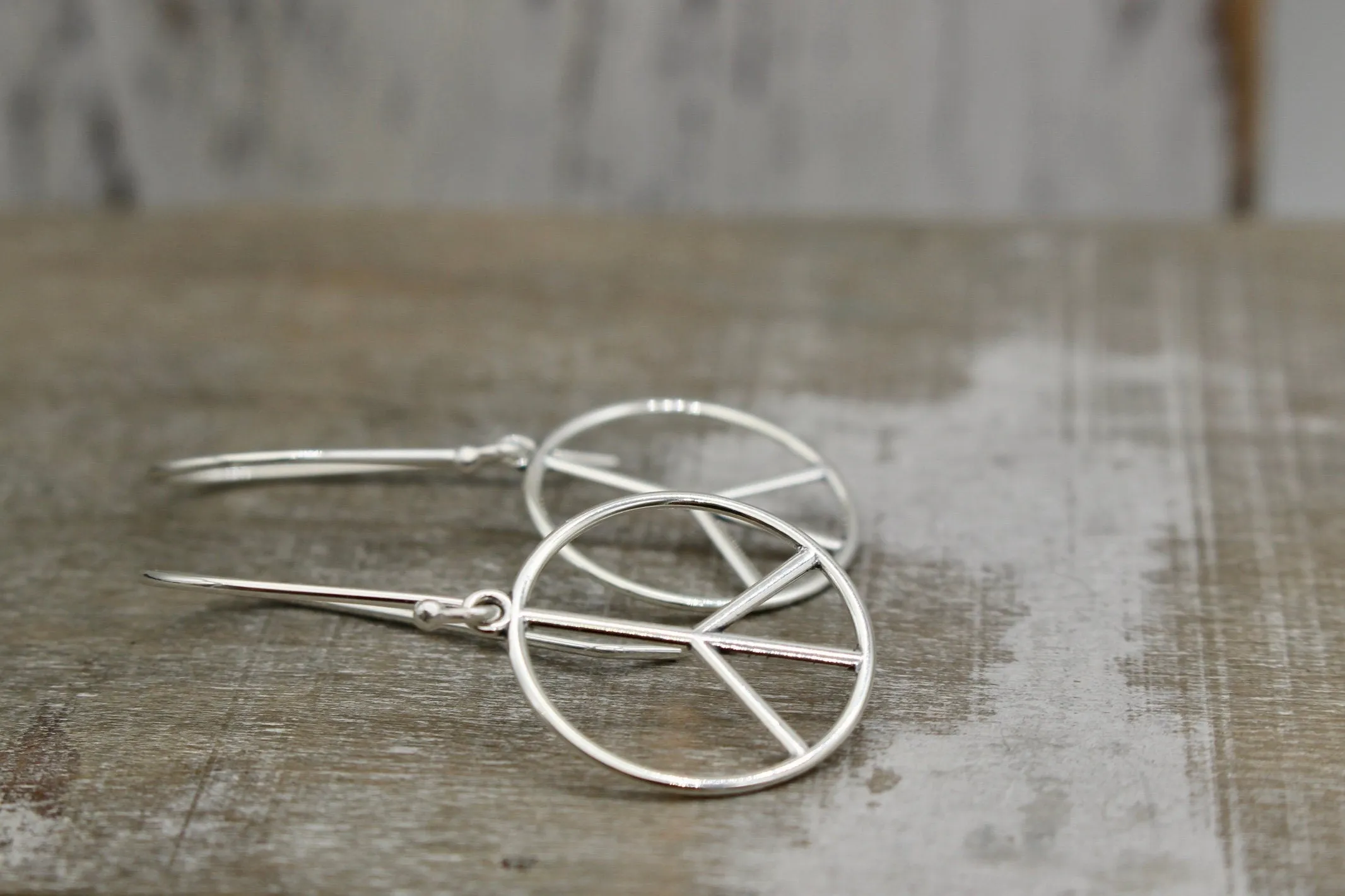 Sterling silver peace earrings